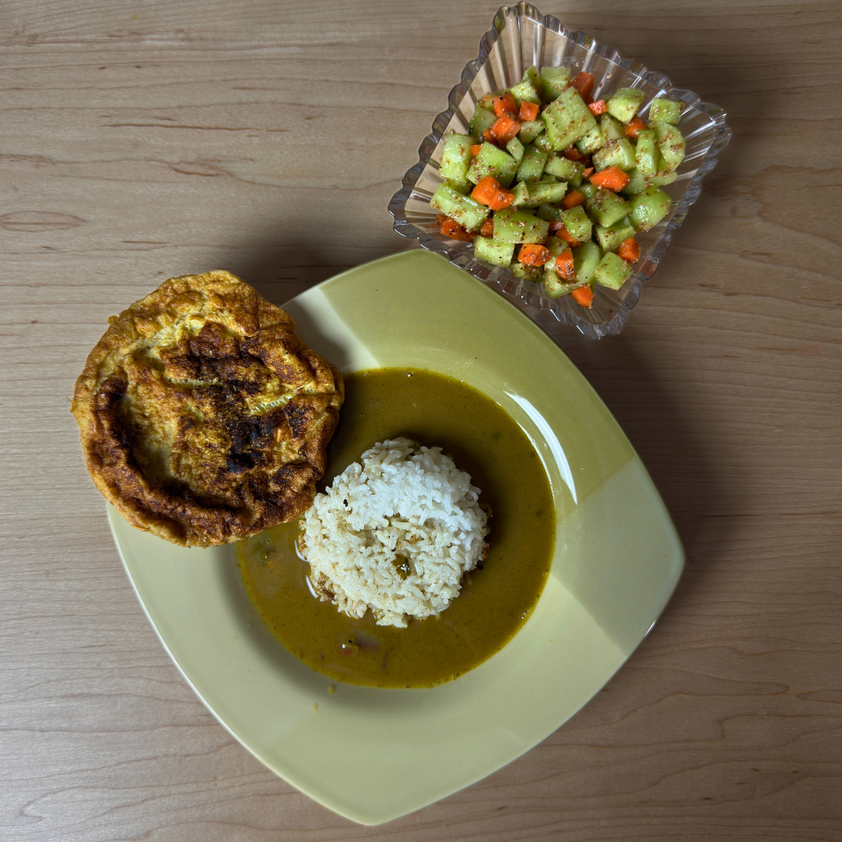 Balanced Thali with white rice, flavorful Ulavacharu Rasam, protein-rich omelet, & crisp salad on a plate.