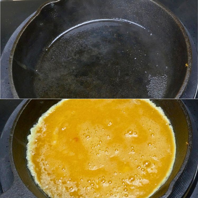 Small cast iron pan heating on stove for cooking perfect omelette