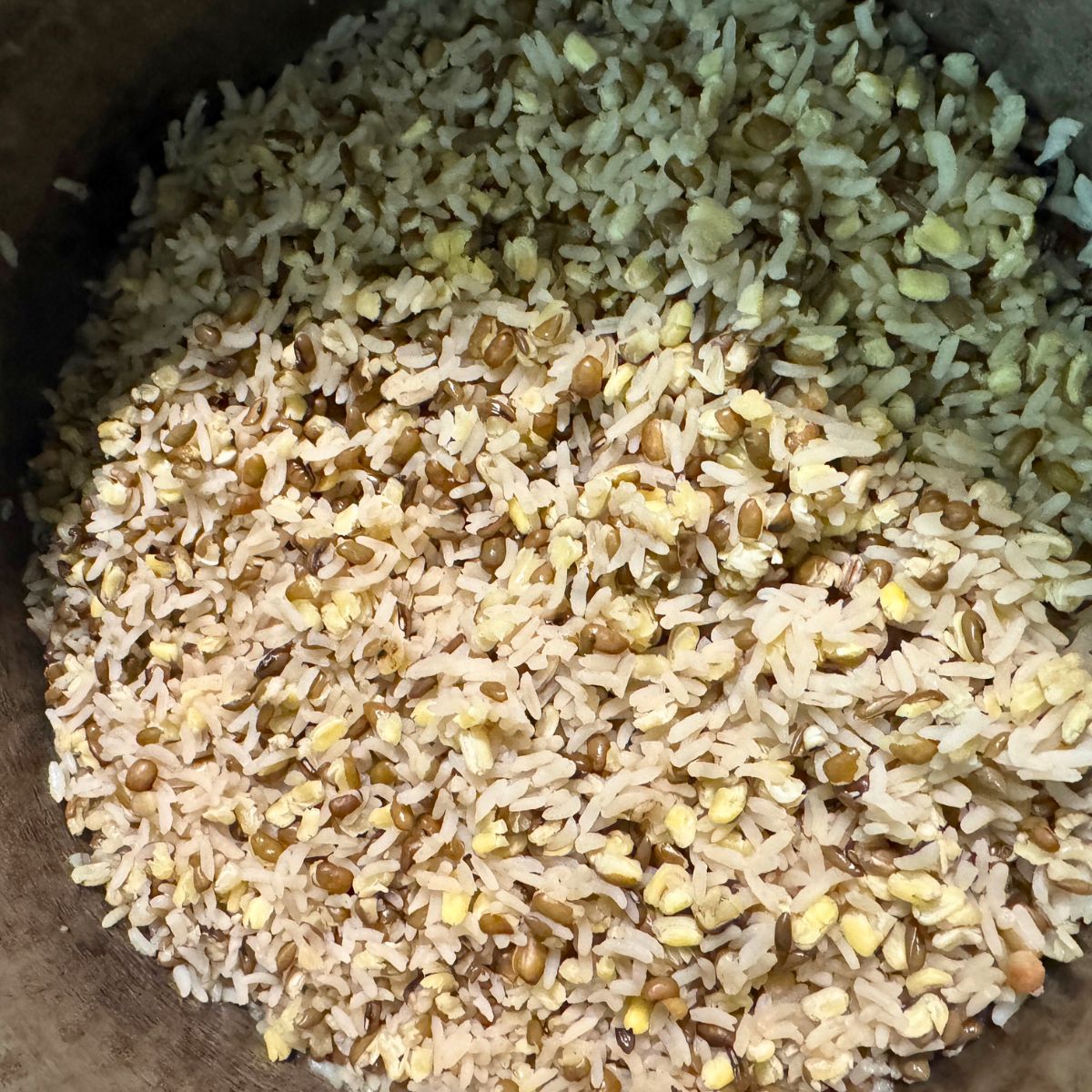 Bowl of fluffy, cooked high-protein rice made with white rice and split green moong dal.