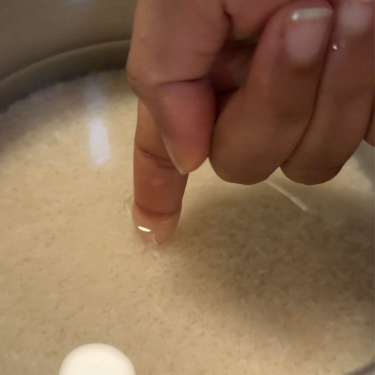 use the index finger trick to fill the water to cook white rice