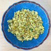 Finished egg bhurji served in a bowl on a wooden table