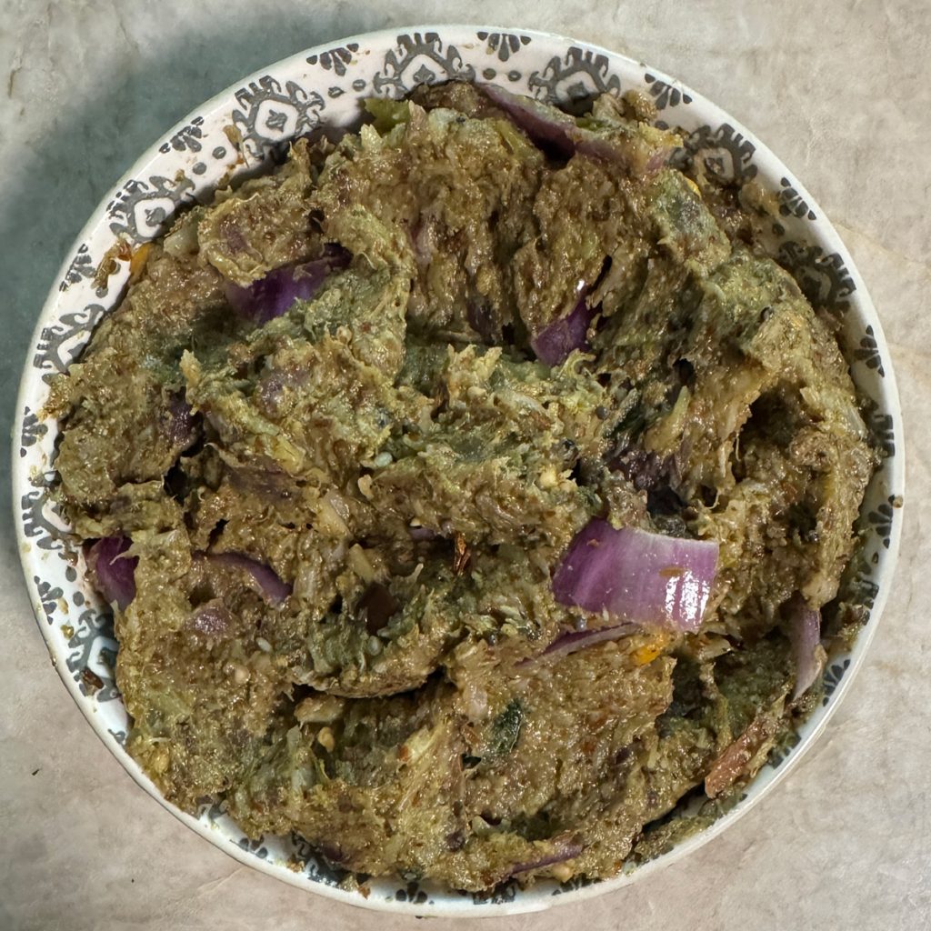 Freshly prepared broccoli eggplant chutney served in a traditional bowl ready to enjoy