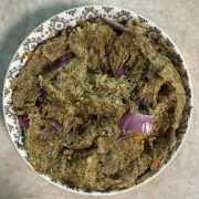 Freshly prepared broccoli eggplant chutney served in a traditional bowl ready to enjoy