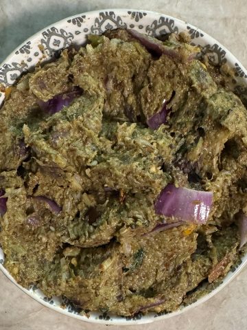 Freshly prepared broccoli eggplant chutney served in a traditional bowl ready to enjoy