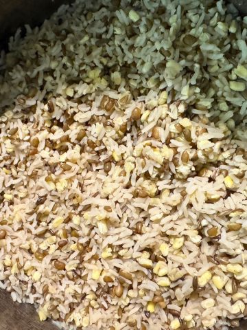 Bowl of fluffy, cooked high-protein rice made with white rice and split green moong dal.