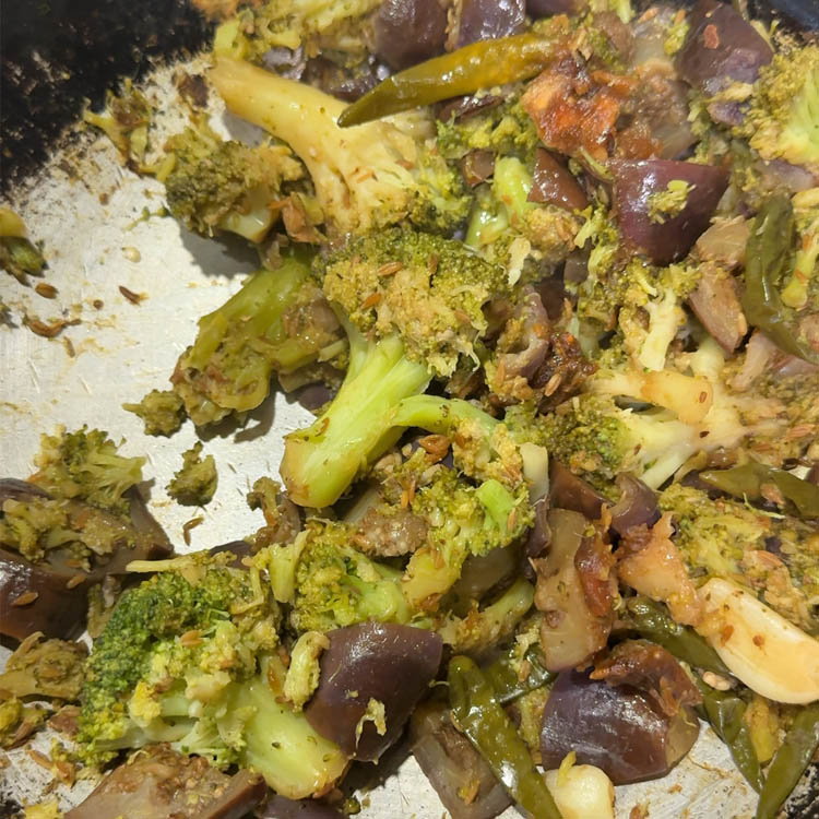 Fully softened broccoli and eggplant mixture ready for grinding into chutney