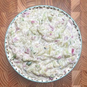 Bottle gourd sorakaya raita garnished with coriander in traditional serving bowl