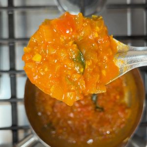 Thick, reddish-brown curry base with proper consistency before adding eggs