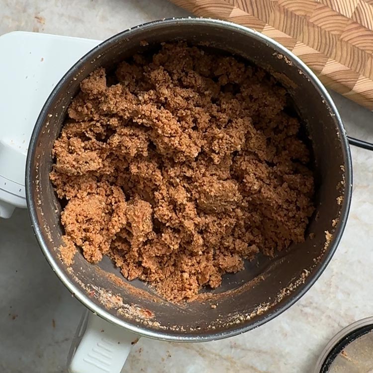 Coarse textured spicy powder with visible peanut pieces after grinding