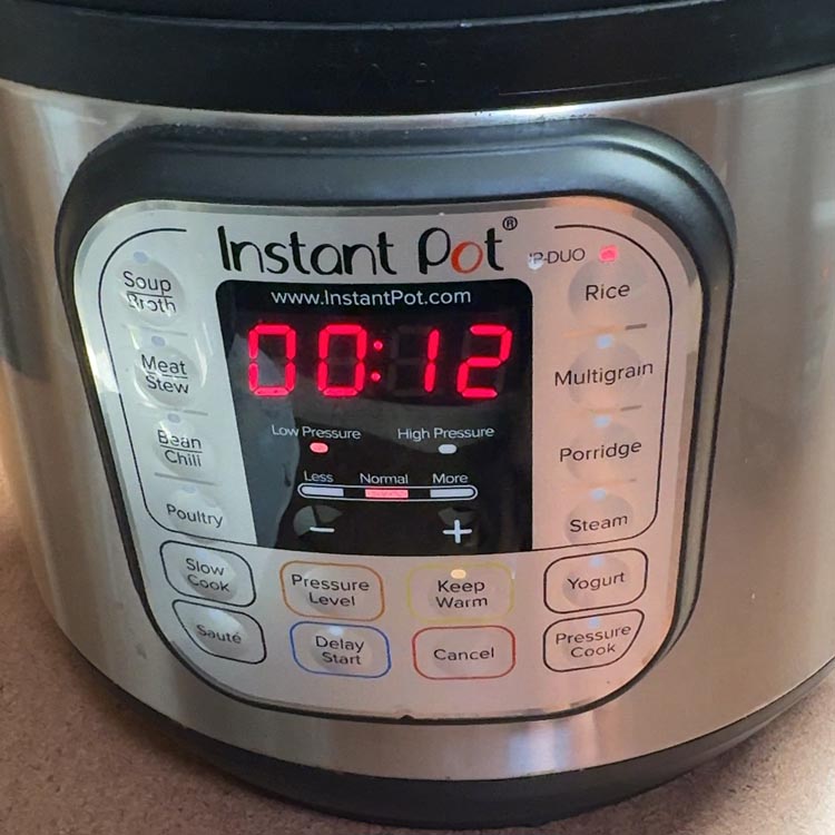Instant Pot display showing 12 minutes low pressure for rice