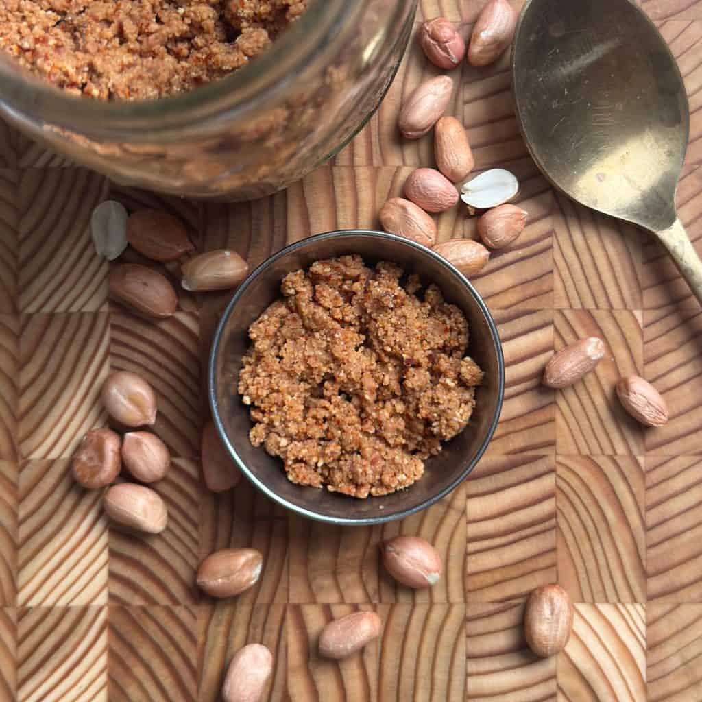 Aromatic Peanut Podi Recipe served in a small ceramic bowl on wooden table