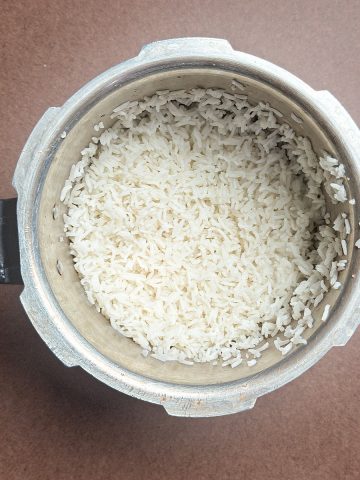 Perfectly cooked white rice in pressure cooker ready to serve
