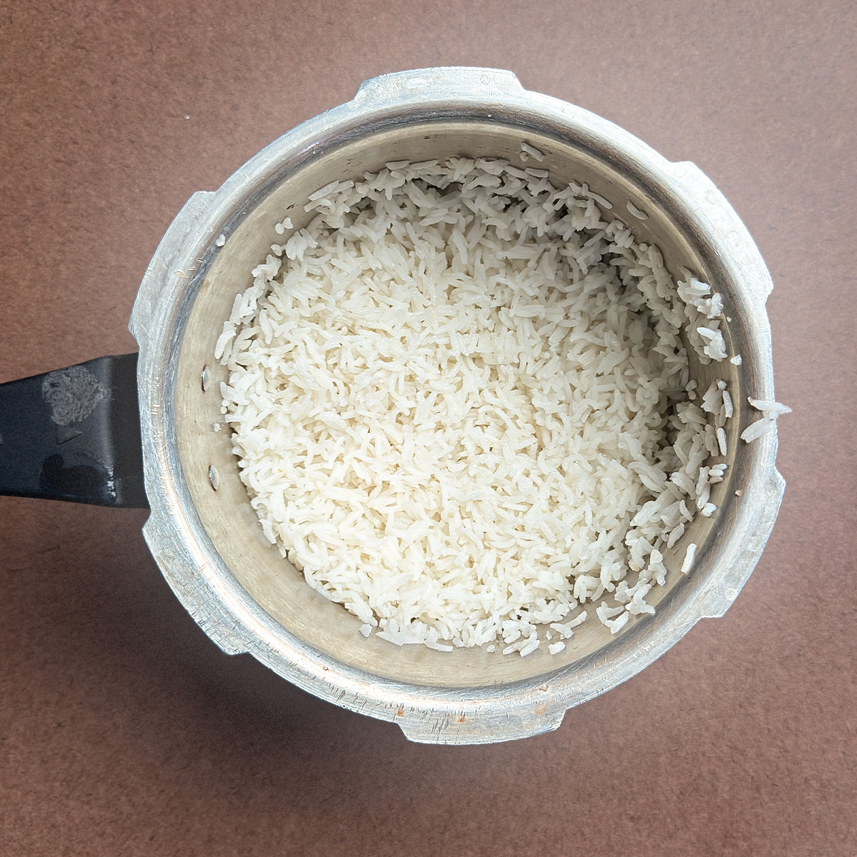 Perfectly cooked white rice in pressure cooker ready to serve