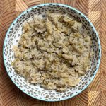 Fluffy cooked high-protein white rice with visible moong dal pieces served in patterned blue bowl