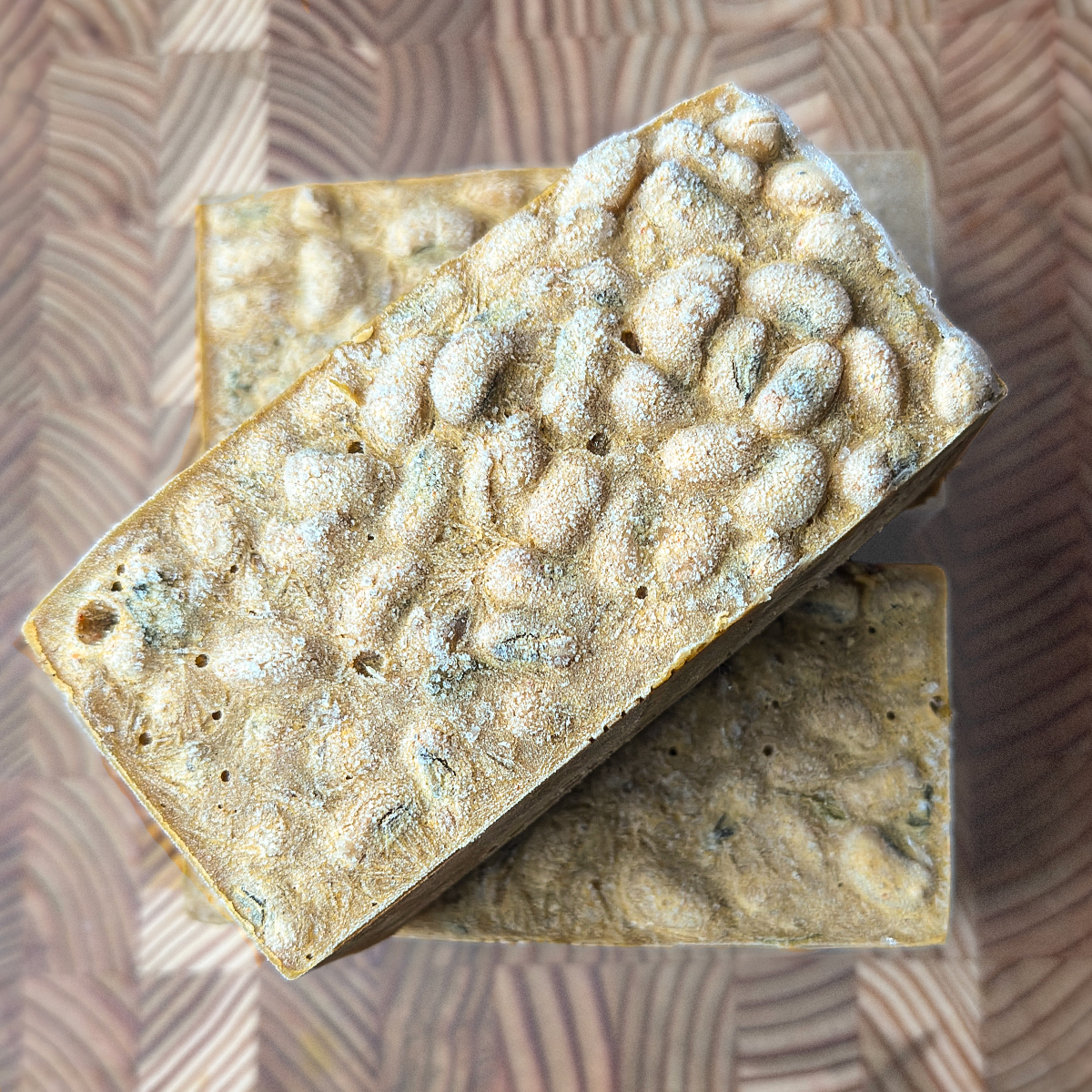 Single cup of curry showing the dense, creamy texture with visible beans throughout the preparation