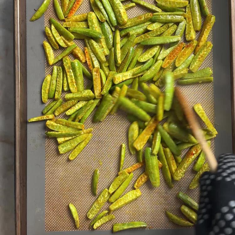 Dondakaya on baking sheet 15 minutes into roasting, ready to flip