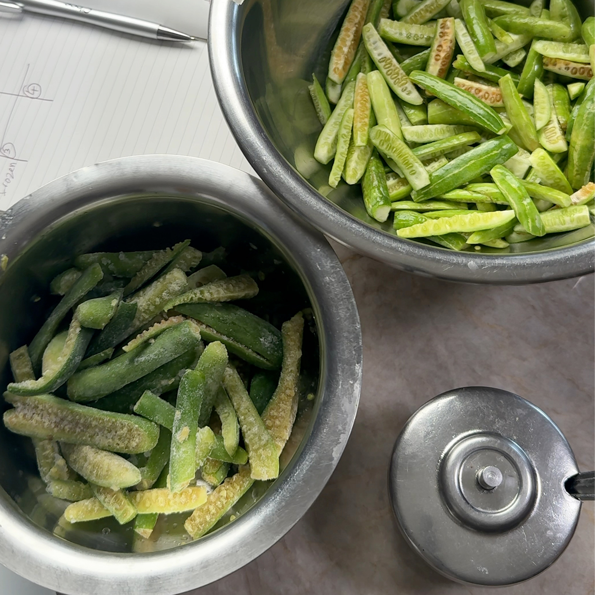 frozen and fresh tindora in bowls on countertop
